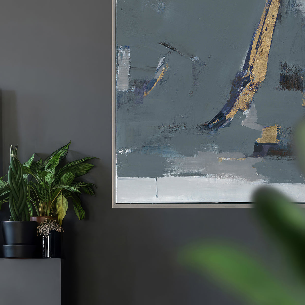 Minimalist abstraction in muted greys and gold creates balance, mystery, and sophistication